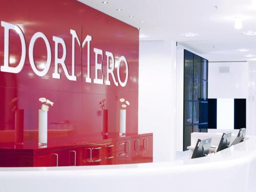 a red wall with the word dorner on it at DORMERO Hotel Hannover in Hannover