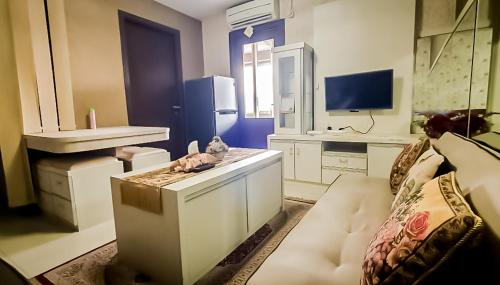 Μια τηλεόραση ή/και κέντρο ψυχαγωγίας στο Tentram Apartment in Galeri Ciumbuleuit 2