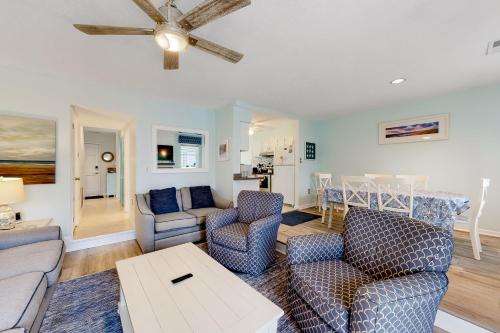 a living room with a couch and chairs and a table at Town of Dewey Beach - 227 Swedes St in Dewey Beach