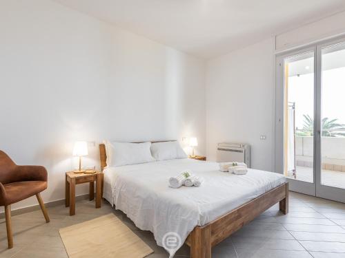 En eller flere senge i et værelse på Poetto Panoramic Apartment