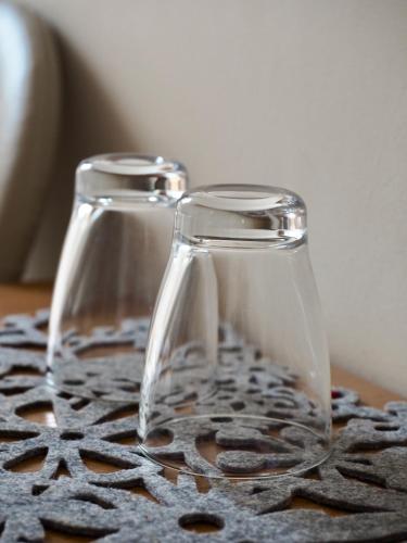 two glass jars sitting on top of a table at Zajazd u Basi in Otyń