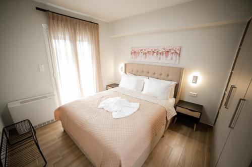En eller flere senge i et værelse på Athens Heart Luxury Penthouse