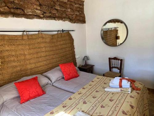 En eller flere senger på et rom på Cortijo Rural Bacares