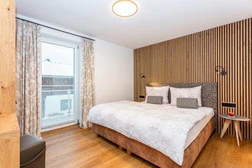 Ein Bett oder Betten in einem Zimmer der Unterkunft Apartmenthaus Maximilian