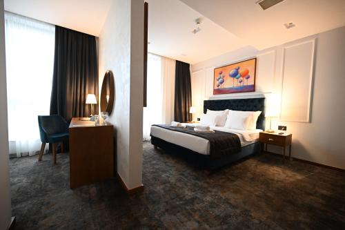 מיטה או מיטות בחדר ב-Hotel Tamiš & Spa