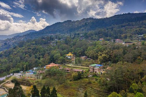 a town in the middle of a mountain at Zostel Homes Pedong, Kalimpong in Kalimpong