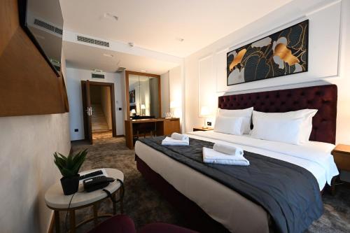 Postel nebo postele na pokoji v ubytování Hotel Tamiš & Spa
