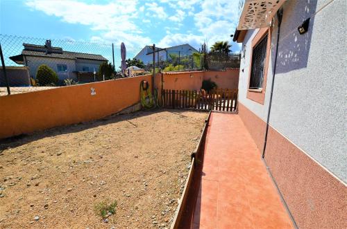 a balcony of a house with a fence at Villa Olombel in Maçanet de la Selva