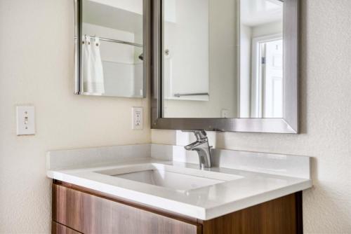 a bathroom with a white sink and a mirror at Sunnyvale 1br w gym pool wd nr highways SFO-1330 in Sunnyvale