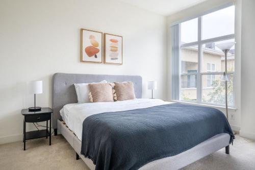 a bedroom with a large bed and a large window at Sunnyvale 1br w gym pool wd nr highways SFO-1330 in Sunnyvale