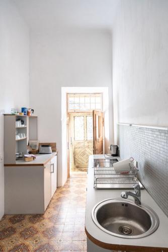 a kitchen with a sink in the middle of it at Schloss Hornegg in Preding