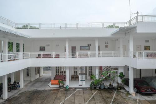an aerial view of a building with a balcony at RedDoorz Plus near UMS Solo in Solo