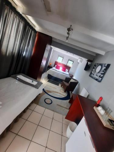 an overhead view of a room with a bed and a table at Lavender Lane in Ladysmith