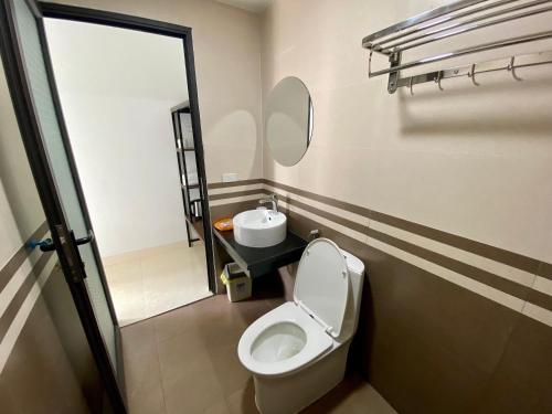 a bathroom with a toilet and a sink at Tam Coc Elegance House in Ninh Binh