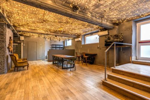 an empty room with a table and chairs in a building at Hostel Trastevere in Rome
