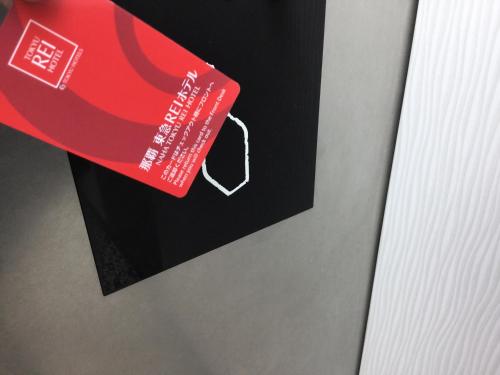 a red tag on the side of a refrigerator at Naha Tokyu REI Hotel in Naha