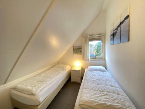 Postel nebo postele na pokoji v ubytování Previnaireweg 20