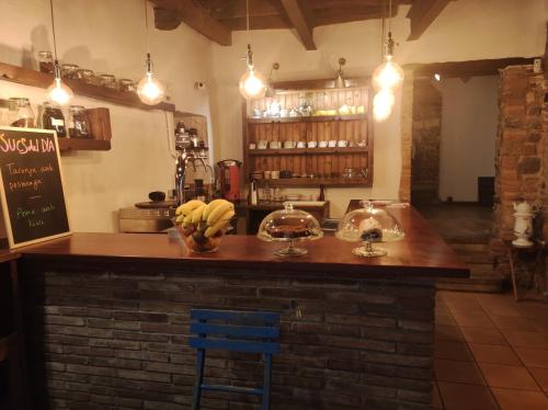 a bar in a restaurant with bananas on the counter at APT 1 Acollidor al Centre Històric de Vic APTGARBI in Vic