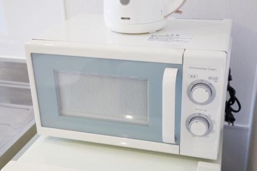 Η κουζίνα ή μικρή κουζίνα στο プロスパービル3b