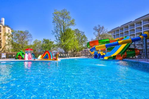 a pool with a water park with a water slide at Prestige Deluxe Hotel Aquapark Club - All inclusive in Golden Sands