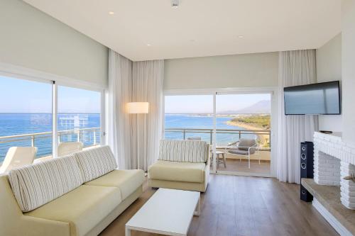 a living room with a view of the ocean at Sol Marbella Estepona Atalaya Park in Estepona