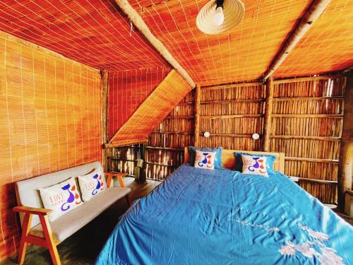a bedroom with a bed in a room with books at Bãi Xếp Beach in Quy Nhon