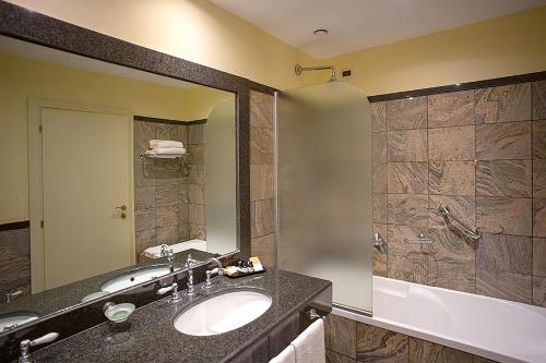 a bathroom with a sink and a shower at Villa Tuscolana in Frascati