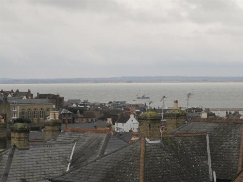 a view of a city with roofs and the water at Endeavour House in Cowes