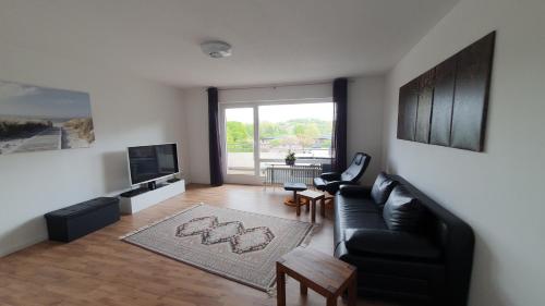 TV a/nebo společenská místnost v ubytování FORUZ - Apartment mit Balkon und Tiefgarage