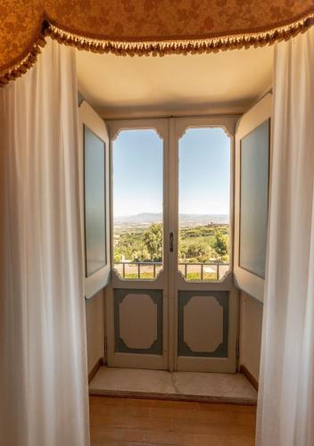 a room with a window with a view at Villa Tuscolana in Frascati