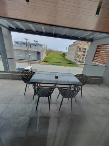 a ping pong table on a patio with two chairs at EUPHORIA ''Staying in Pleasure'' in Paralia Katerinis