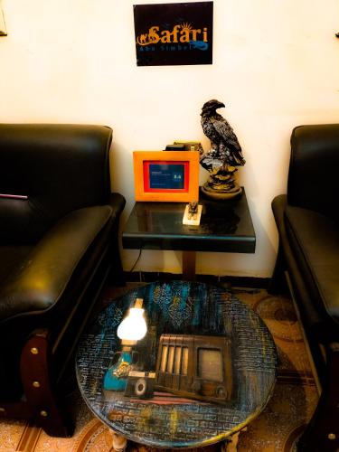 a coffee table with a bird sitting on top of a table at Safari Abu Simbel in Abu Simbel