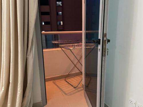 an open door to a room with a window at Hostel - bedspace for Ladies سكن - سرير للبنات in Al Khān