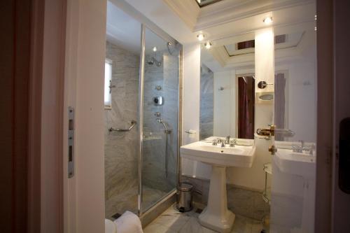 a bathroom with a sink and a shower at Hotel Albani Firenze in Florence