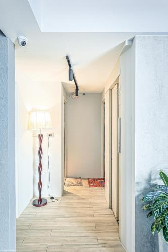 a hallway with a floor lamp and a lampost at 亞馨文旅 近東大門夜市 有免費停車場 可自助入住 in Hualien City