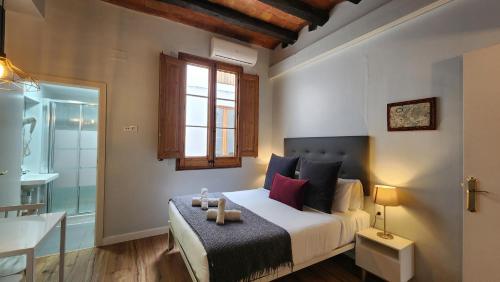 Posteľ alebo postele v izbe v ubytovaní Barrio Gotico Apartments Ferran