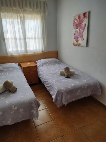A bed or beds in a room at Aldeas De Aguamarina Phase I