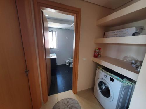 a laundry room with a washer and dryer in it at Mountain Meets Sea-Spectacular View in Orikum Apartment in Orikum