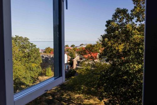 an open window with a view of a house at Best Western Solhem Hotel in Visby