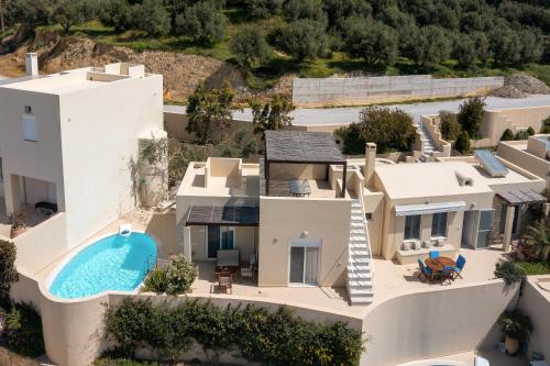 an aerial view of a house with a swimming pool at Plakias Panorama Homes in Plakias