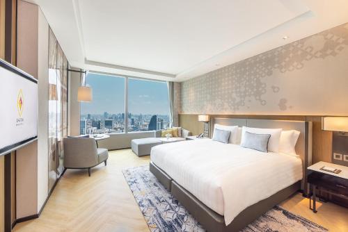 Un ou plusieurs lits dans un hébergement de l'établissement Eastin Grand Hotel Phayathai
