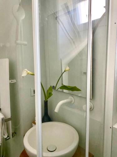 a bathroom with a white toilet and a sink at Il Fiordo in Conca dei Marini