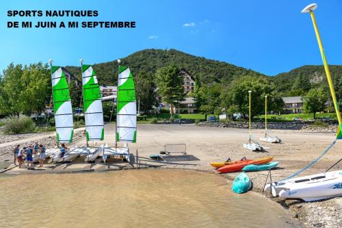 a beach with sail boats on the sand at Village Club Les Hyvans in Chorges