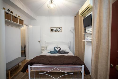 A bed or beds in a room at Akis studio Liston square area Corfu