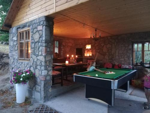 a room with a pool table in a house at Willa Sielsko Anielsko in Szklarska Poręba