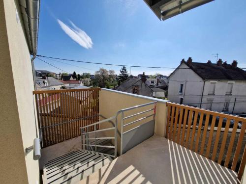 a balcony with a stair railing on a building at Résidence La Pyro in Bourges