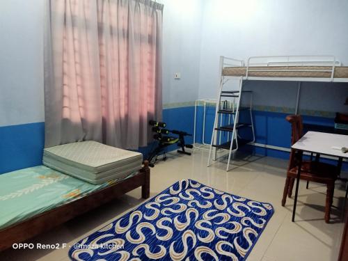 Postel nebo postele na pokoji v ubytování McZa Homestay