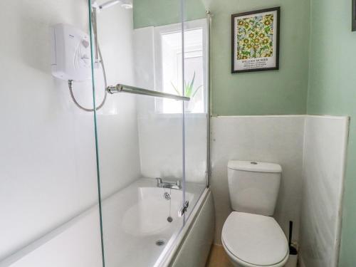 a bathroom with a toilet and a shower at 4 Pulmans Place in Halifax