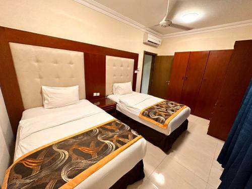 מיטה או מיטות בחדר ב-Star Apartments