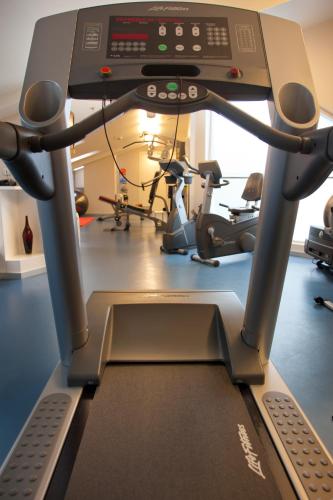a gym with a treadmill and treadles at Hotel Zinema7 in Donostia-San Sebastián